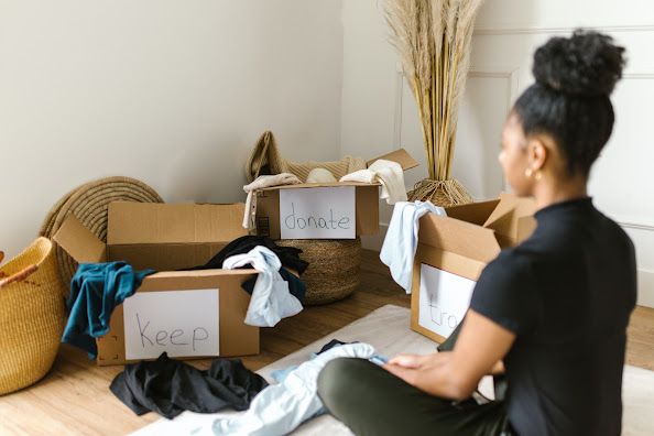 woman looking at boxes to unpack and organized